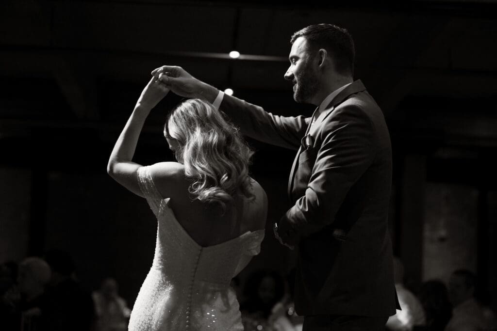 a couple has their first dance as a married couple at Windows on the River in Cleveland, Ohio